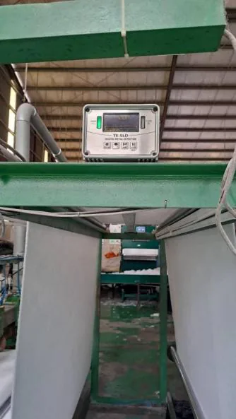 Metal detector inspecting fiber sheet